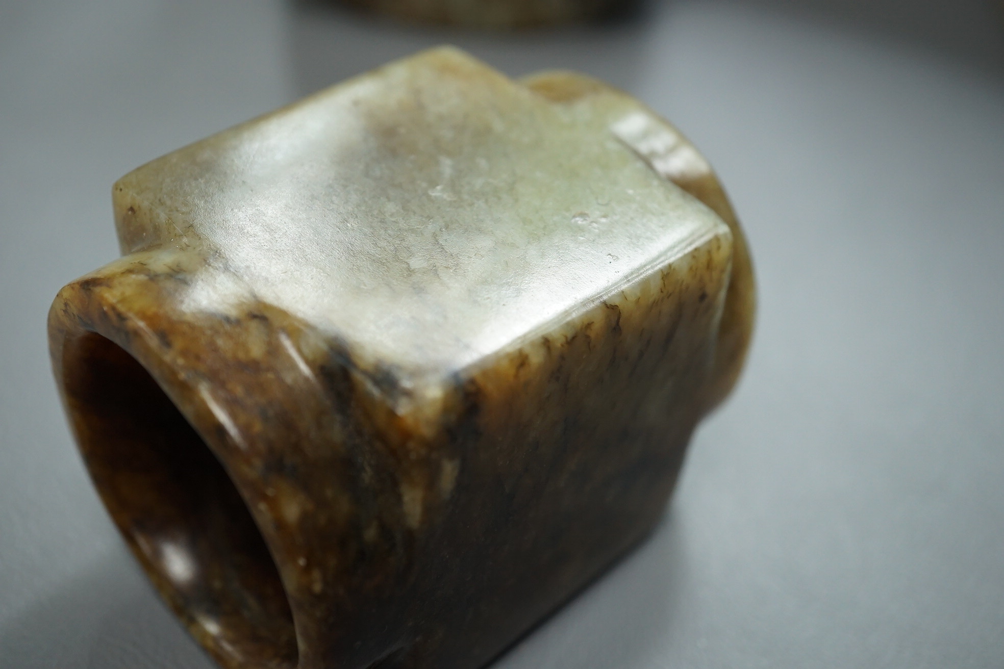 Four Chinese archaistic jade or hardstone cong